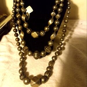 Used,not new 3 separate different length necklaces in a matte pewter color.